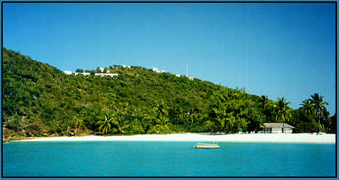 View of White Bay beach, the beach hut, and cottages on the ridge