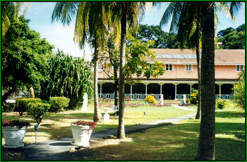 Plantation House hotel at the end of the walkway