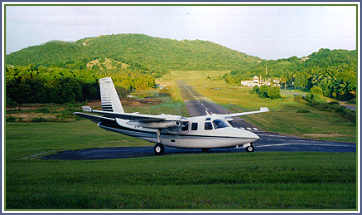 Click me to see a plane land and take off on this tiny runway!