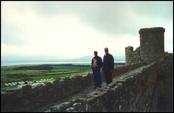 Bill & Kenny high on Harlech castle walls - sea in background