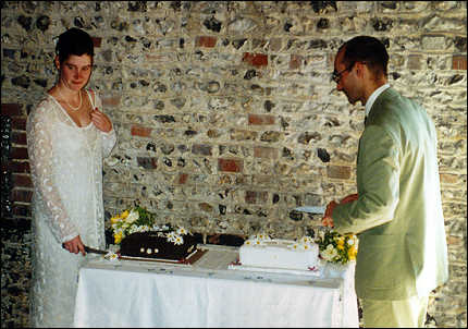 Kara and Nick cutting the cakes