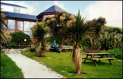 Kenny sitting in the Old Coastguard Inn's gardens