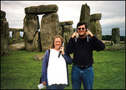 Katherine (5 months pregnant with twins) and Jeff listening to phone-recorders