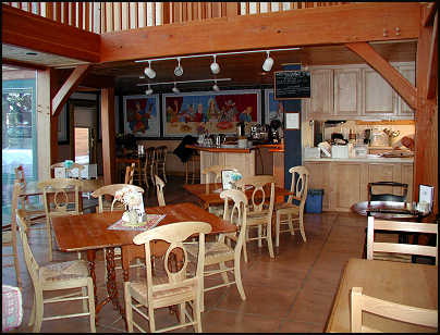 Great room with dining tables and cozy sitting area