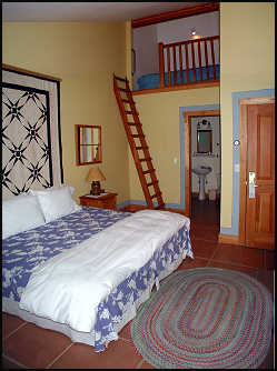 One of the loft rooms with ladder to the double bed above.