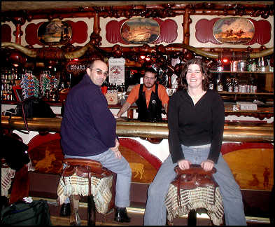 Nick and Kara riding a saddle in the Million Dollar Cowboy Bar